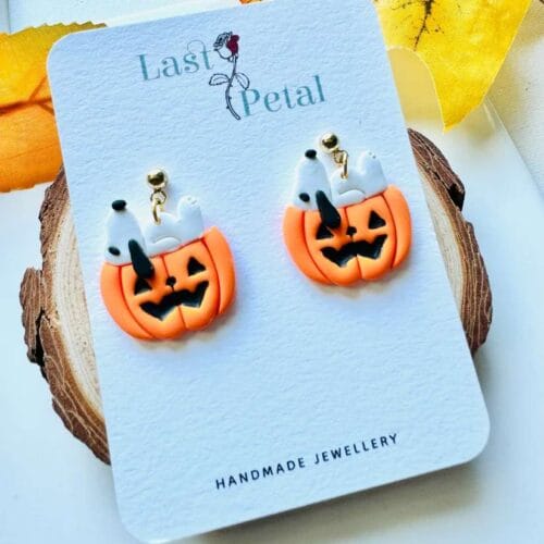 Snoopy pumpkin Dangle. Snoopy resting on a spooky pumpkin.