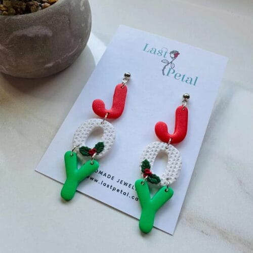 Dangling letter in red white and green spelling Joy, they are JOY Christmas earrings